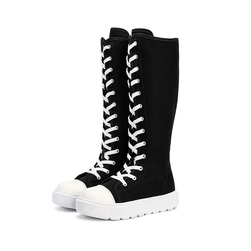 Liela izmēra sieviešu apavi Cross Border 2025. gada pavasara vienkārši gari, līdz ceļgaliem sniedzoši zābaki, jaunas, augstas augšdaļas, siksniņas ar rāvējslēdzēju sānos, audekla kurpes