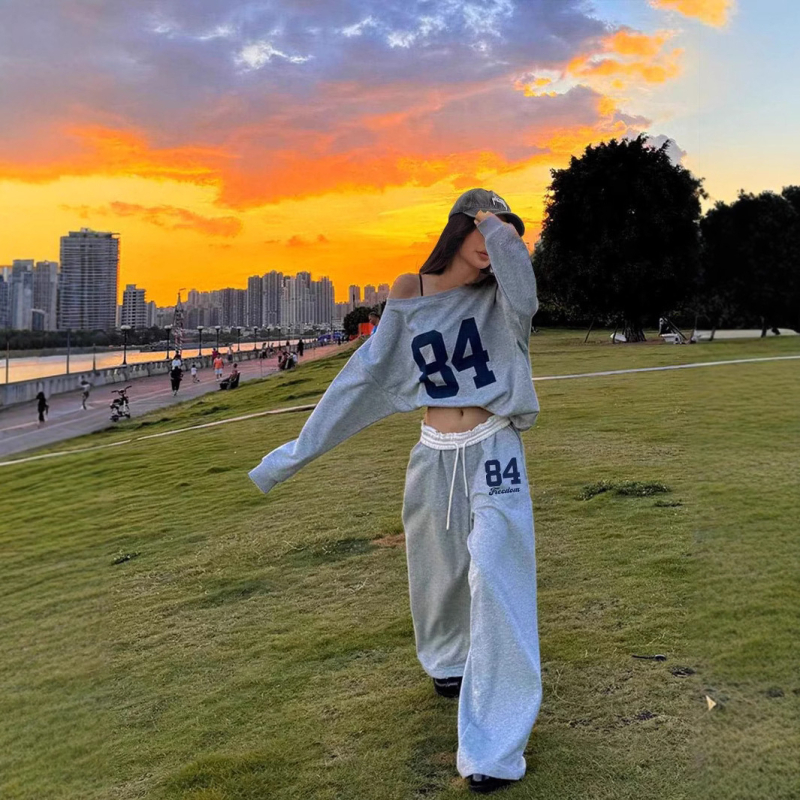 Europski i američki ženski proljetni i jesenski digitalni tisak asimetričnog ovratnika s dugim rukavima i hlačama, ležerni dvodijelni tvornički veleprodajni proizvod