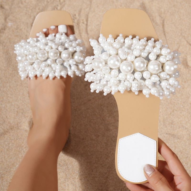 Naiste kandiliste ninaosadega helmestega romantilised valged lamedad rannasussid väliskaubanduseks, saadaval otsetarnetamiseks, mugavad lamedad kingad naistele