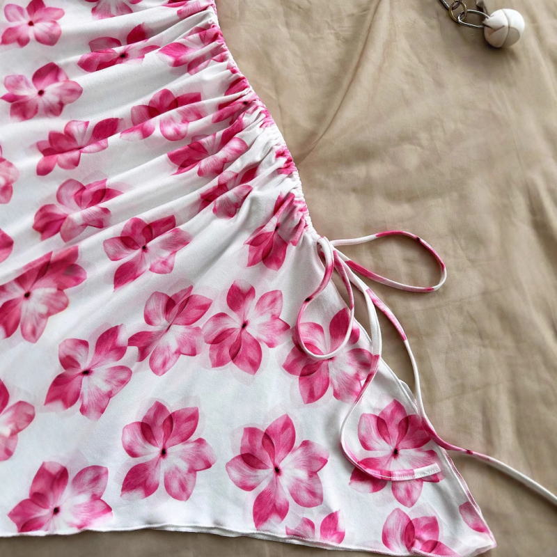 2025-ös európai és amerikai női szexi, pántos, nyári, virágmintás, aszimmetrikus szegélyű, ünnepi stílusú, pánt nélküli, karcsúsított ruha