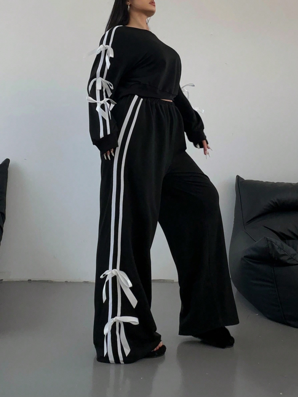 Határokon átnyúló új amerikai utcai személyiségtrend divattervezés érzék oldalsó masni karcsúsított pulóver melegítőruha