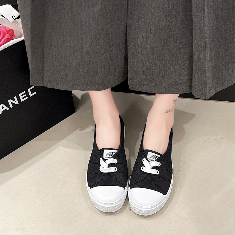 Textil fehér cipők női 2025 tavaszi új lapos talpú, sekély szájú, alacsony szárú, alkalmi vászon, egyszínű, szövet cipők raktáron