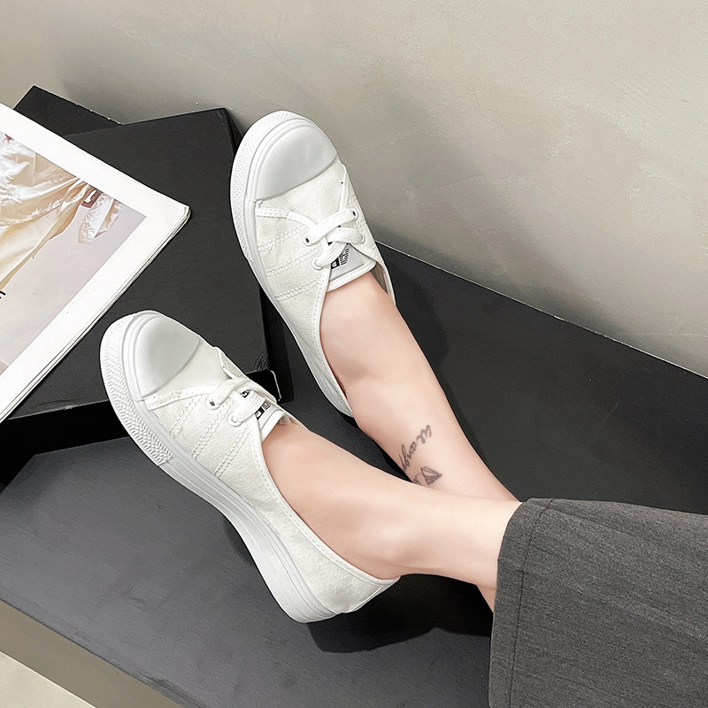 Textil fehér cipők női 2025 tavaszi új lapos talpú, sekély szájú, alacsony szárú, alkalmi vászon, egyszínű, szövet cipők raktáron
