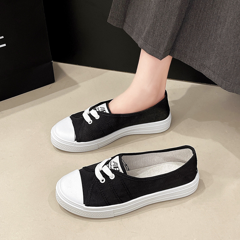 Textil fehér cipők női 2025 tavaszi új lapos talpú, sekély szájú, alacsony szárú, alkalmi vászon, egyszínű, szövet cipők raktáron