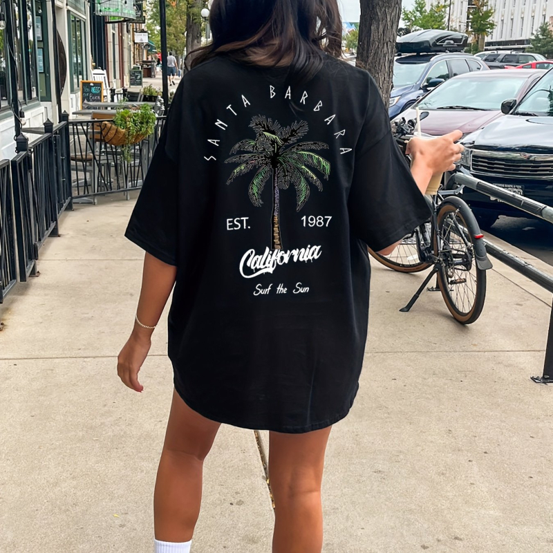 Kerek nyakú, kókuszfa mintás, keresztezett szegélyű pólóruha, tavaszi és nyári lezser, rövid ujjú, fekete női ruházat