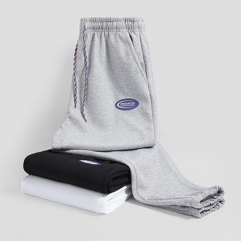 2022 Új Stílusú, forró gofrimintás divatmárka nadrág férfi tavaszi divatos sportnadrág bő orrú lezser nadrág