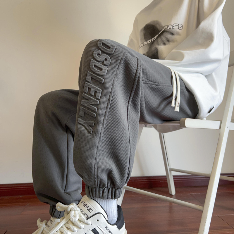 Nove proljetne muške ležerne hlače u hongkonškom stilu, mladenačke, jednobojne, jednostavne, s utisnutim slovima, labave sportske hlače s vezanjem po gležnjevima
