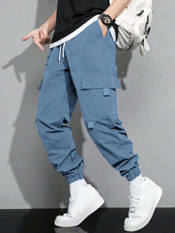 Pánske jarné a jesenné nové jednofarebné jednoduché americké štýlové mládežnícke voľné pracovné nohavice s viacerými vreckami
