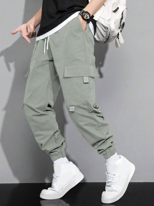 Pánske jarné a jesenné nové jednofarebné jednoduché americké štýlové mládežnícke voľné pracovné nohavice s viacerými vreckami