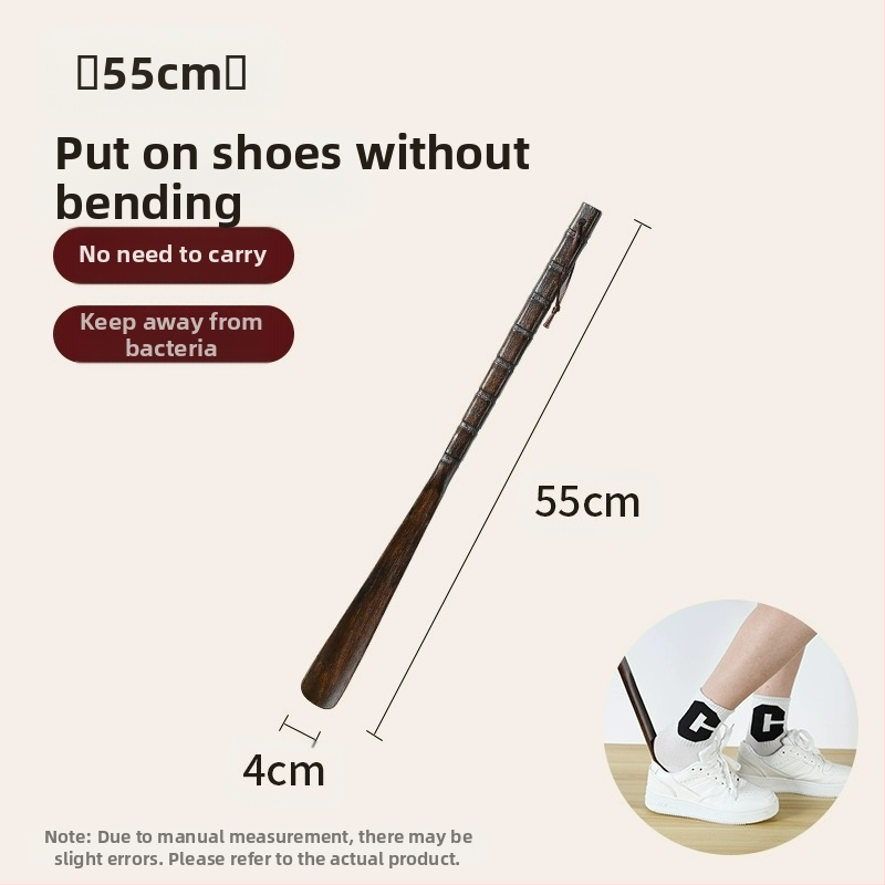 Täispuidust kingatõmmits majapidamises, pika käepidemega, eakad rasedad naised, mitte painutatud kingatõmmits, kulunud kinga artefakt, puidust kingatõmmits, säästab aega