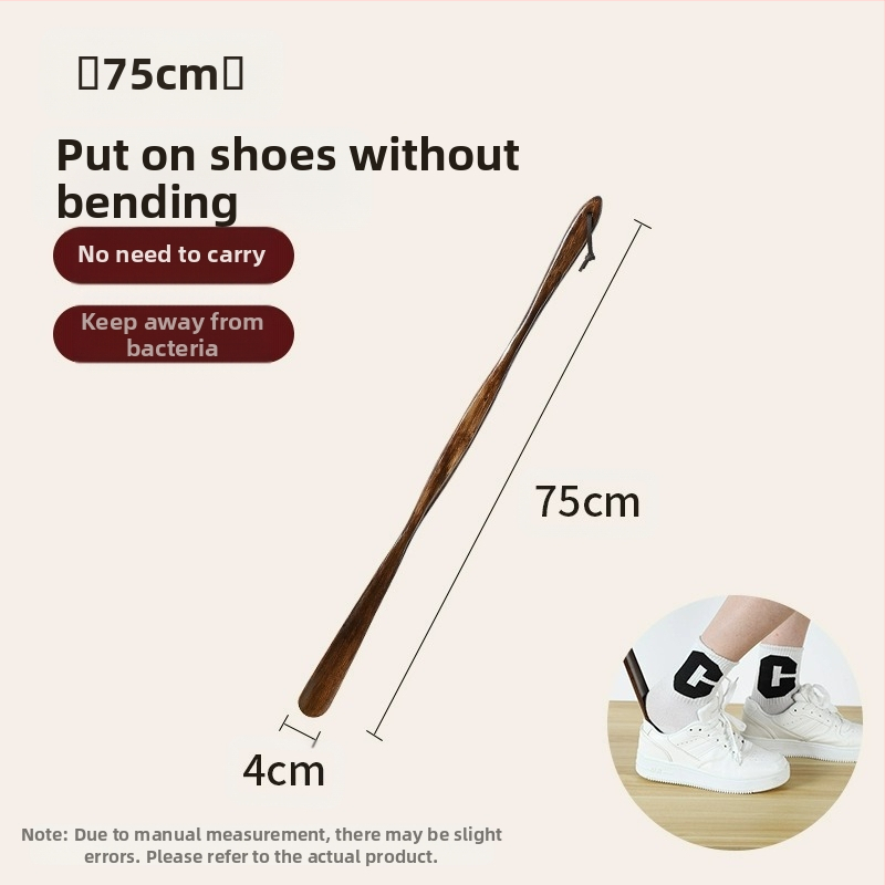 Täispuidust kingatõmmits majapidamises, pika käepidemega, eakad rasedad naised, mitte painutatud kingatõmmits, kulunud kinga artefakt, puidust kingatõmmits, säästab aega