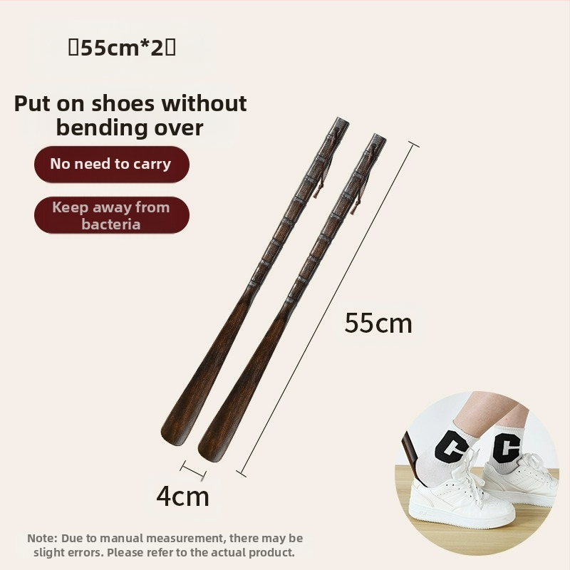 Täispuidust kingatõmmits majapidamises, pika käepidemega, eakad rasedad naised, mitte painutatud kingatõmmits, kulunud kinga artefakt, puidust kingatõmmits, säästab aega