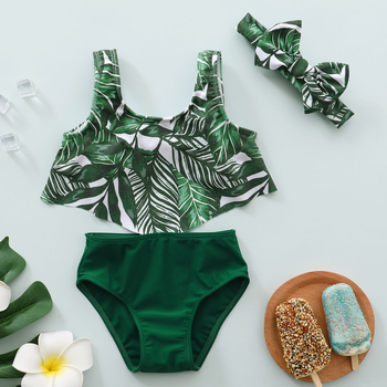 Tüdrukute kevad- ja sügis 2021 uus Euroopa ja Ameerika moodne varrukateta lootoselehega pitsimustriga pluus + ühevärvilised kolmeosalised ujumispüksid