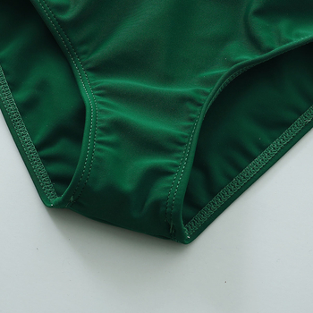 Tüdrukute kevad- ja sügis 2021 uus Euroopa ja Ameerika moodne varrukateta lootoselehega pitsimustriga pluus + ühevärvilised kolmeosalised ujumispüksid