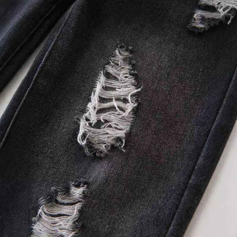 Euroopa ja Ameerika väliskaubanduse laste riided uued tüdrukute suurte aukudega retro teksad vabaaja retuusid koonusjad püksid pikad püksid