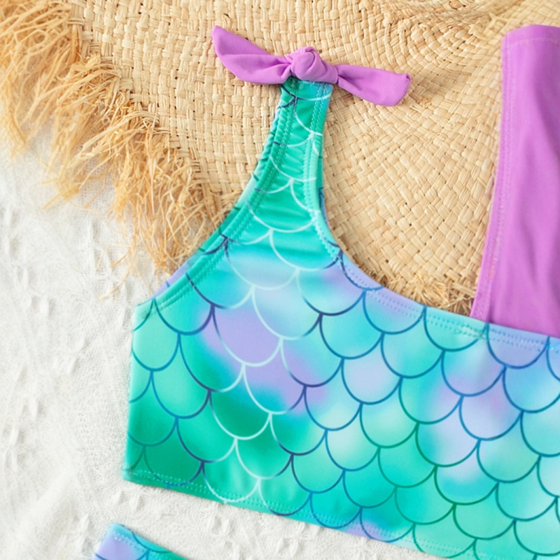 Tüdrukute kaldus õlaga kalasoomustega bikiinid 2025. aasta uus tüdrukute lõhestatud bikiinid laste ujumistrikoo