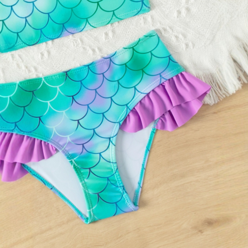 Tüdrukute kaldus õlaga kalasoomustega bikiinid 2025. aasta uus tüdrukute lõhestatud bikiinid laste ujumistrikoo