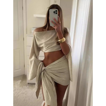 Νέο σετ δύο τεμαχίων με καυτή εορταστική μόδα σε διασυνοριακό στυλ, σέξι φούστα με λοξό γιακά και ώμους, κοντή φούστα με τοπ και τελείωμα