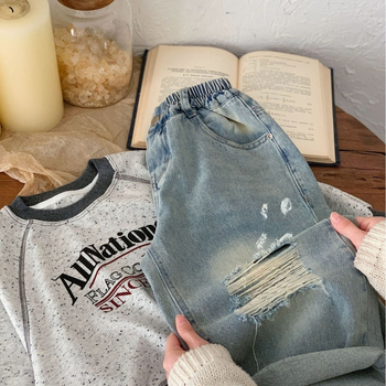 Παιδικά τζιν 2025 Άνοιξη Αγόρια και Κορίτσια Εξατομικευμένα τζιν με σπρέι βαφής, παντελόνια με σκισίματα για μωρά