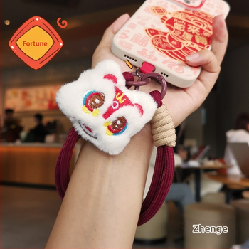 2025 m. prabangios nuotaikos Naujųjų metų raudonas mobiliojo telefono virvelis, mielas pliušinis liūto lėlės pakabukas ant riešo, trumpas