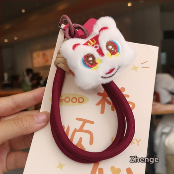 2025 m. prabangios nuotaikos Naujųjų metų raudonas mobiliojo telefono virvelis, mielas pliušinis liūto lėlės pakabukas ant riešo, trumpas