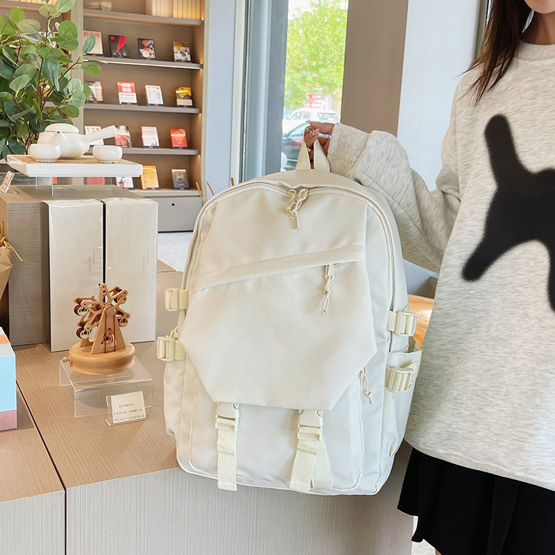 Trendikas brändikott, millel on kohandatud logoga seljakott, trendikas õpilase koolikott, kolledži üliõpilastele mõeldud meeste ja naiste väljaminev kott