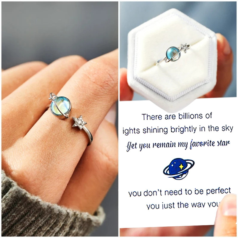 Nepriklausomos stoties naujas Europos ir Amerikos kūrybingas asmenybės žvaigždės ir mėnulio mikroinkrustuotas baltas akmuo mažina nerimo spaudimą, besisukantis žiedas