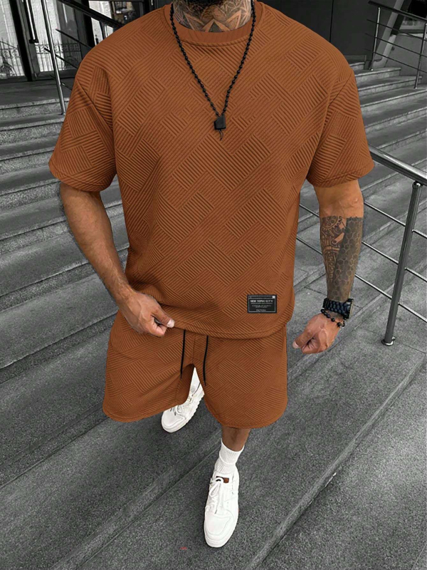 Suvine ühevärviline tekstuuriga ülikond Meeste lühikeste varrukatega T-särk Lühikesed püksid Meeste kaheosaline spordiriietus Vabaajariietus Meeste ME2-MA1