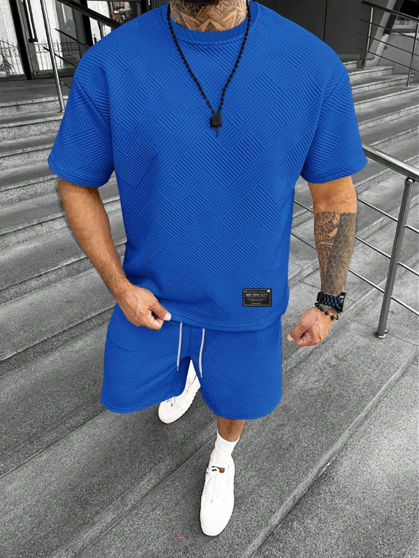 Suvine ühevärviline tekstuuriga ülikond Meeste lühikeste varrukatega T-särk Lühikesed püksid Meeste kaheosaline spordiriietus Vabaajariietus Meeste ME2-MA1