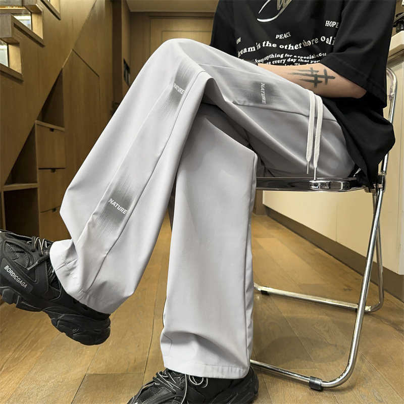 Pánske ležérne nohavice rovného strihu s bočným pruhom a písmenami, všestranné na jar a jeseň, štýlové a športové tepláky, vďaka ktorým budete vyzerať vyššie, dlhé nohavice so širokými nohavicami