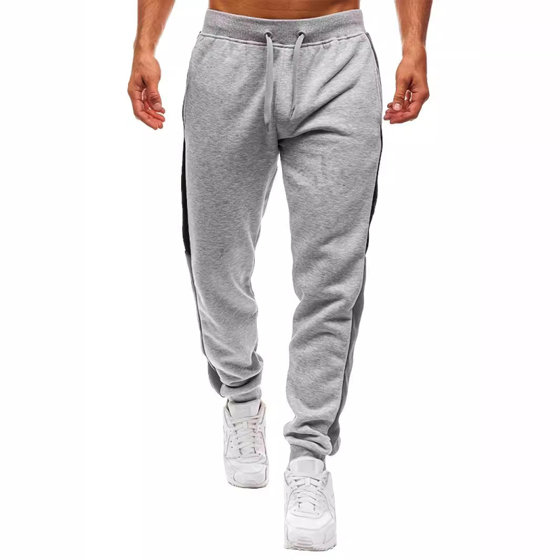 Europietiško dydžio plius dydžio „Aliexpress“ eksportuojamos geriausiai parduodamos sportinės kelnės. Mados kelnės su sujungimo dizainu. Sportinės kelnės.