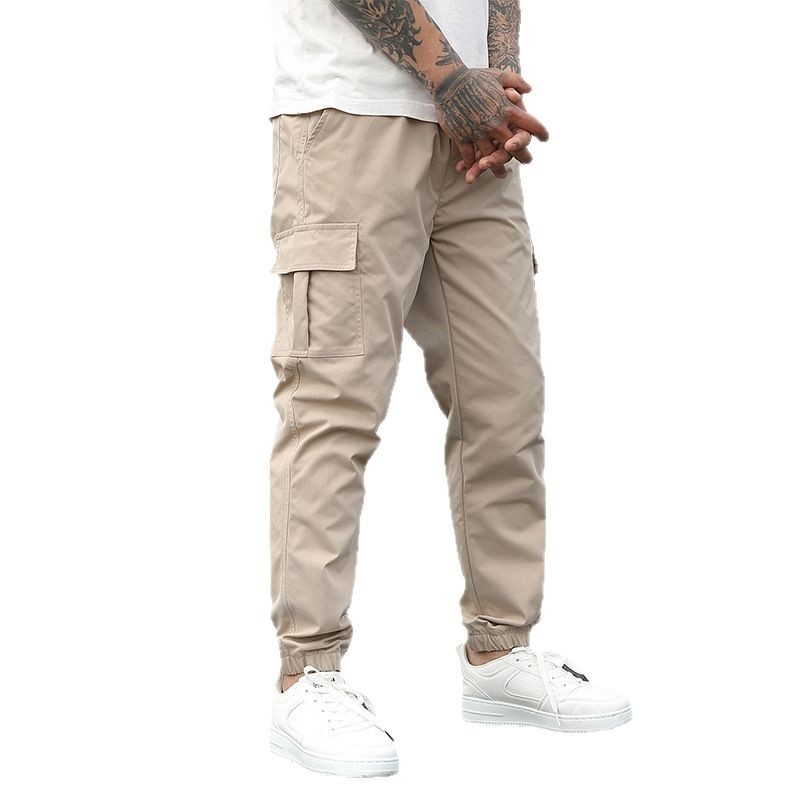 Furnizare directă transfrontalieră de salopete bărbătești, pantaloni lejeri casual cu nouă puncte de închidere, șnururi, colanți cu mai multe buzunare, pantaloni versatili