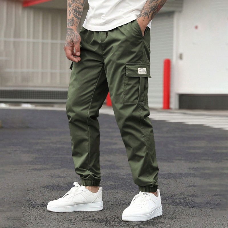 Furnizare directă transfrontalieră de salopete bărbătești, pantaloni lejeri casual cu nouă puncte de închidere, șnururi, colanți cu mai multe buzunare, pantaloni versatili