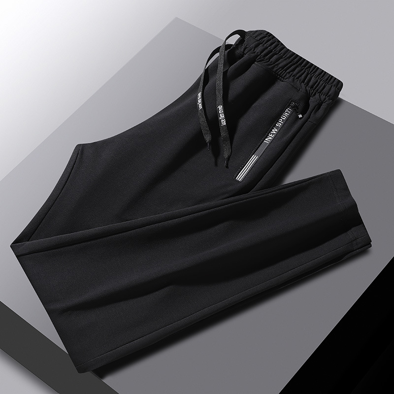 Jarné a jesenné ležérne nohavice pánske voľné nohavice so zaviazanými členkami, pánske tepláky vo veľkých veľkostiach, trendy športové nohavice pre mladých a stredných vekových kategórií.