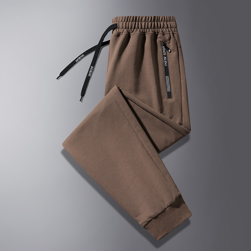Jarné a jesenné ležérne nohavice pánske voľné nohavice so zaviazanými členkami, pánske tepláky vo veľkých veľkostiach, trendy športové nohavice pre mladých a stredných vekových kategórií.