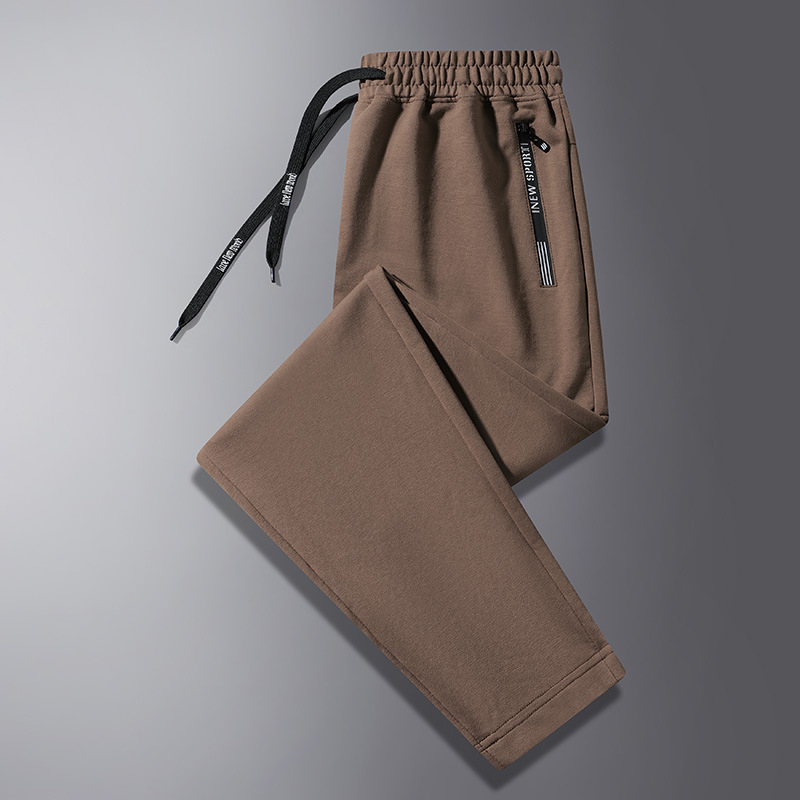Jarné a jesenné ležérne nohavice pánske voľné nohavice so zaviazanými členkami, pánske tepláky vo veľkých veľkostiach, trendy športové nohavice pre mladých a stredných vekových kategórií.