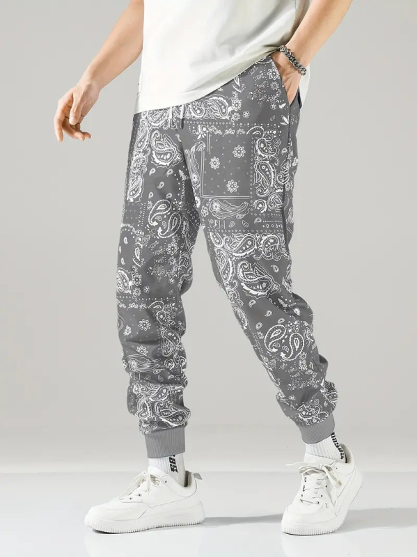 2025. aasta kevad- ja sügisesed uued Euroopa ja Ameerika Hongkongi stiilis lahtised meeste püksid, sügisesed populaarsed kamuflaažitrükiga spordipüksid ML01