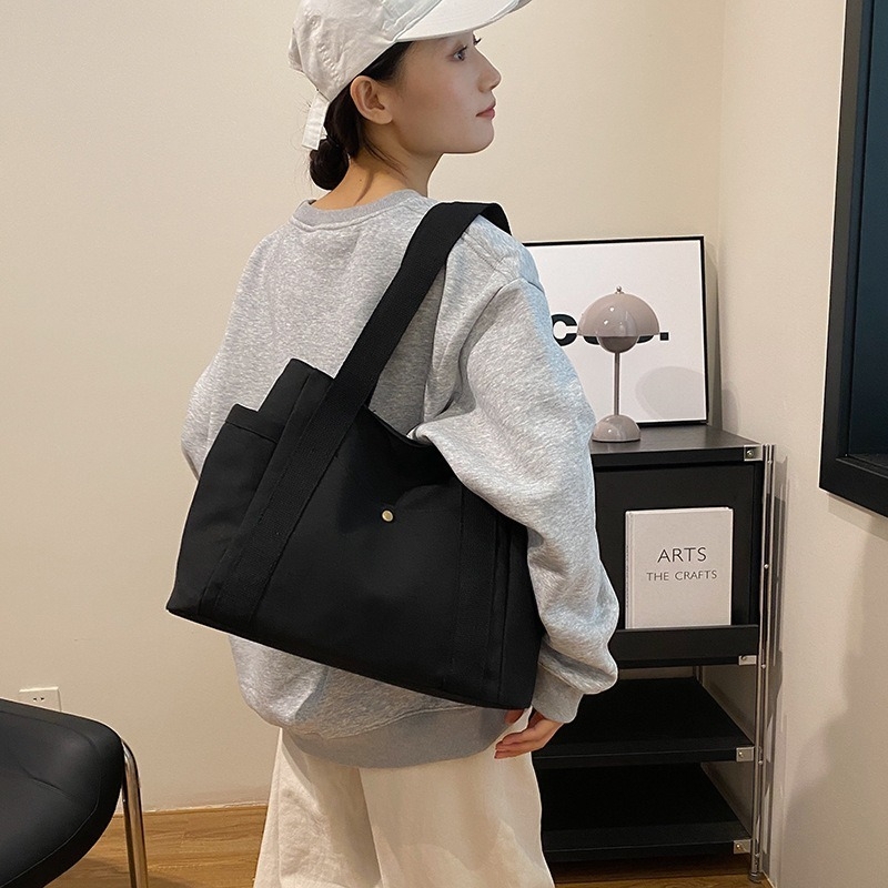 2024. aasta uus lõuendikott, naiste universaalne õlakott, suure mahutavusega raamatutega täidetud õpilase klassiruumi pendeldajakott, uus käekott