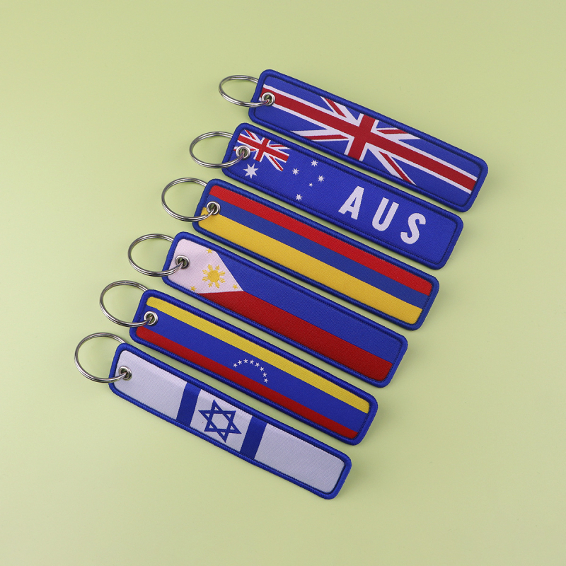 Piiriülene riigilipu võtmehoidja, kudumismärgiga võtmehoidja, kaelarihm, ülikoolilinnaku juurdepääsukontrolli büroo sertifikaat, rippuvad kaunistused, kudumisriidest võtmehoidja