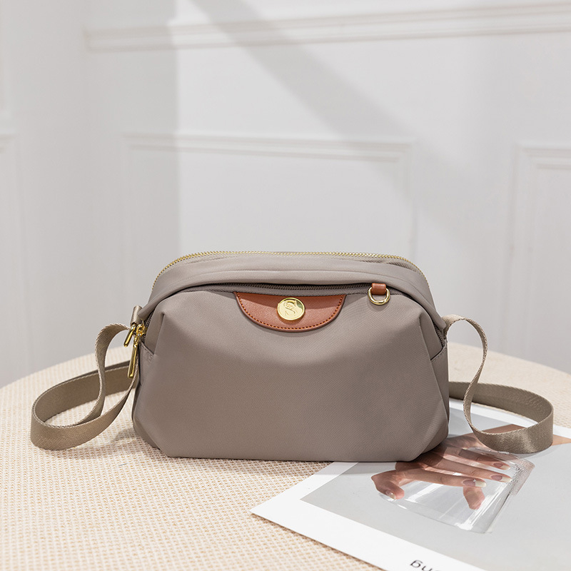 Guangzhou kotid 2025 uus lõuendist moodne õlakott naiste õlakott väike suvine vabaaja kott lihtsaim mängu mobiiltelefonikott