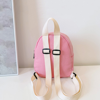 Piiriülene lastekoti seljakott, ühevärviline lõuend, kerge kaalu vähendav väike kott, tüdrukute koolikott, vabaaja väike kott meestele ja naistele