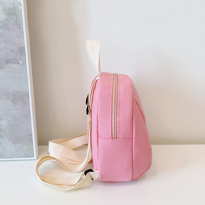 Piiriülene lastekoti seljakott, ühevärviline lõuend, kerge kaalu vähendav väike kott, tüdrukute koolikott, vabaaja väike kott meestele ja naistele