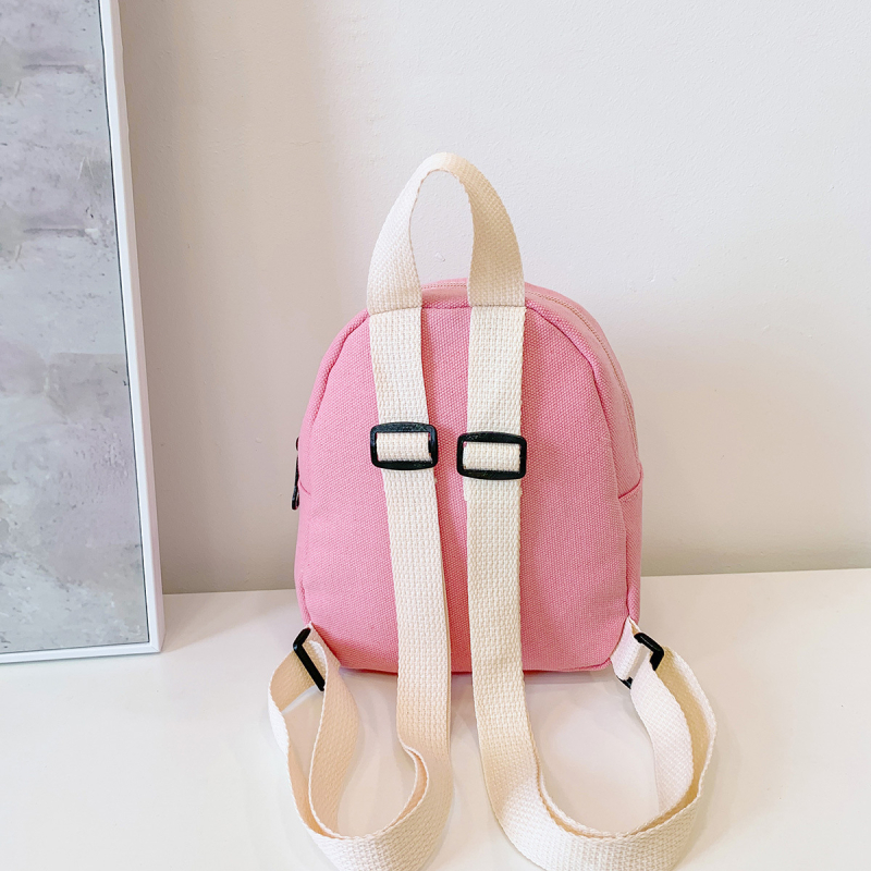 Piiriülene lastekoti seljakott, ühevärviline lõuend, kerge kaalu vähendav väike kott, tüdrukute koolikott, vabaaja väike kott meestele ja naistele