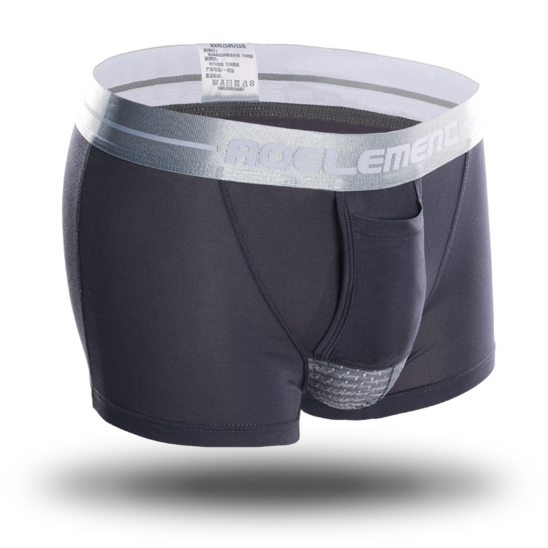 Spermatinio virželio atskyrimas kulka, kapšelio atrama, vyriški apatiniai, vyriški veniniai apatiniai šortai, krepšys, išlenkta boksininko galva.