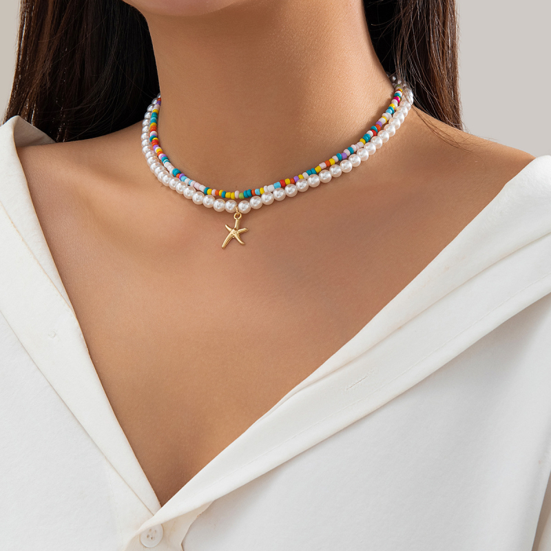 Euroopa ja Ameerika stiilis piiriülesed riisihelmed ranna-ookeani kuumalt müüdavad aksessuaarid, mis sobivad kokku meritähe kaelakeega, koorega kaelakee naiste ehted