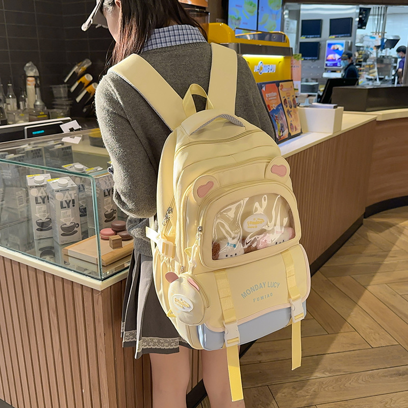 Jauna multfilmu stila bērnu mugursoma, maza, svaiga, jauka, lielas ietilpības skolēnu plecu soma, kas paredzēta došanās uz nodarbībām un skolēnu somu