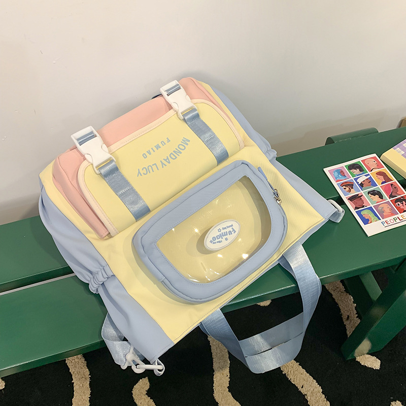Jauna multfilmu stila bērnu mugursoma, maza, svaiga, jauka, lielas ietilpības skolēnu plecu soma, kas paredzēta došanās uz nodarbībām un skolēnu somu