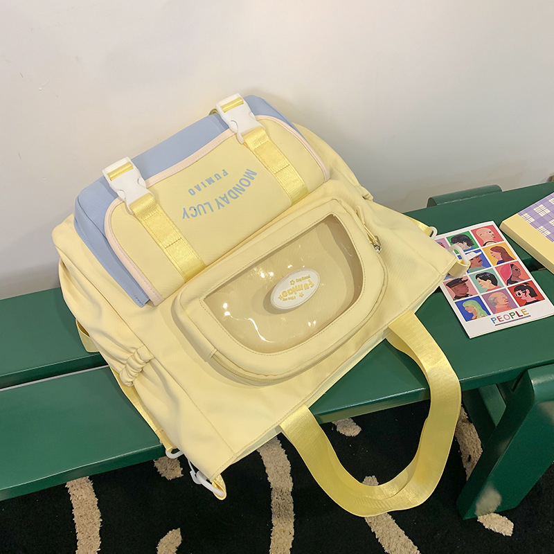 Jauna multfilmu stila bērnu mugursoma, maza, svaiga, jauka, lielas ietilpības skolēnu plecu soma, kas paredzēta došanās uz nodarbībām un skolēnu somu