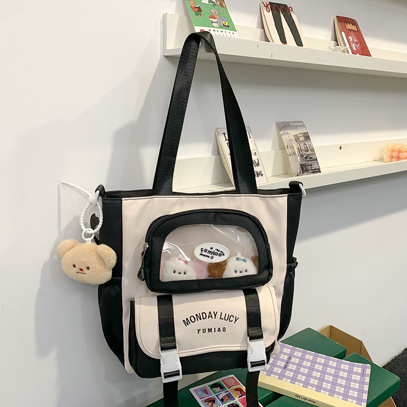 Jauna multfilmu stila bērnu mugursoma, maza, svaiga, jauka, lielas ietilpības skolēnu plecu soma, kas paredzēta došanās uz nodarbībām un skolēnu somu