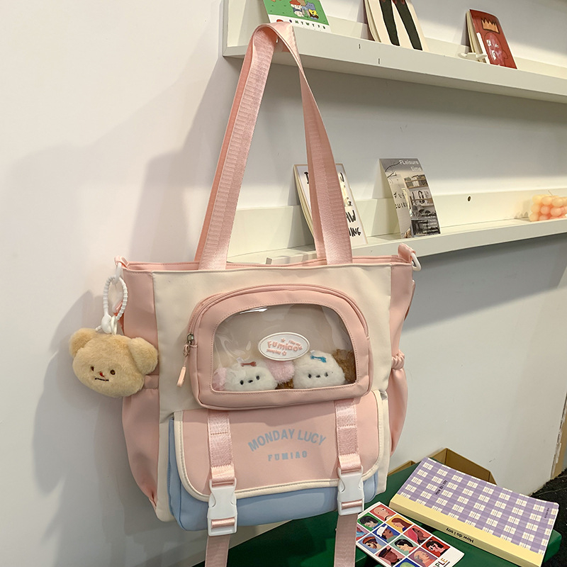 Jauna multfilmu stila bērnu mugursoma, maza, svaiga, jauka, lielas ietilpības skolēnu plecu soma, kas paredzēta došanās uz nodarbībām un skolēnu somu